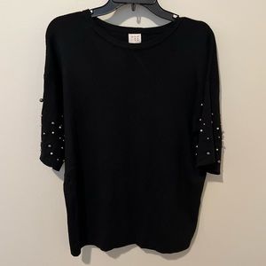 Black top with multi-colored pearls on arms